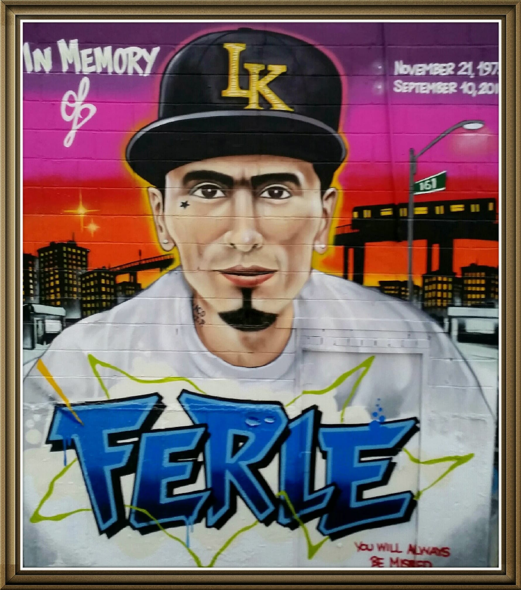 A painted mural of a person with a hat, and the word 'Ferle' written under it